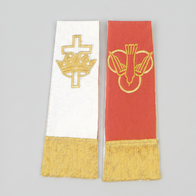Two stoles with embroidered designs on a white background