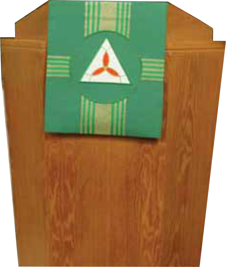 Wooden lectern with a green and white decorative banner featuring a red triangle symbol.