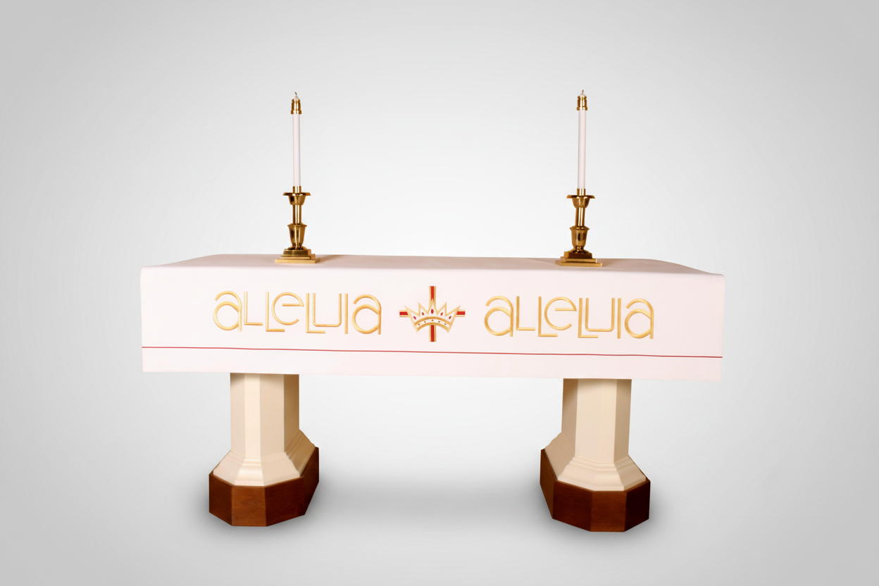 Decorative table with 'Alleluia' text and candle holders on a white background