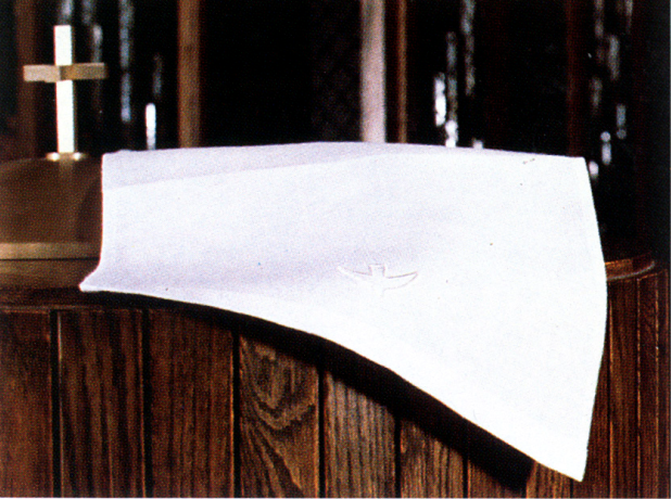 White cloth on a wooden surface with a blurred background