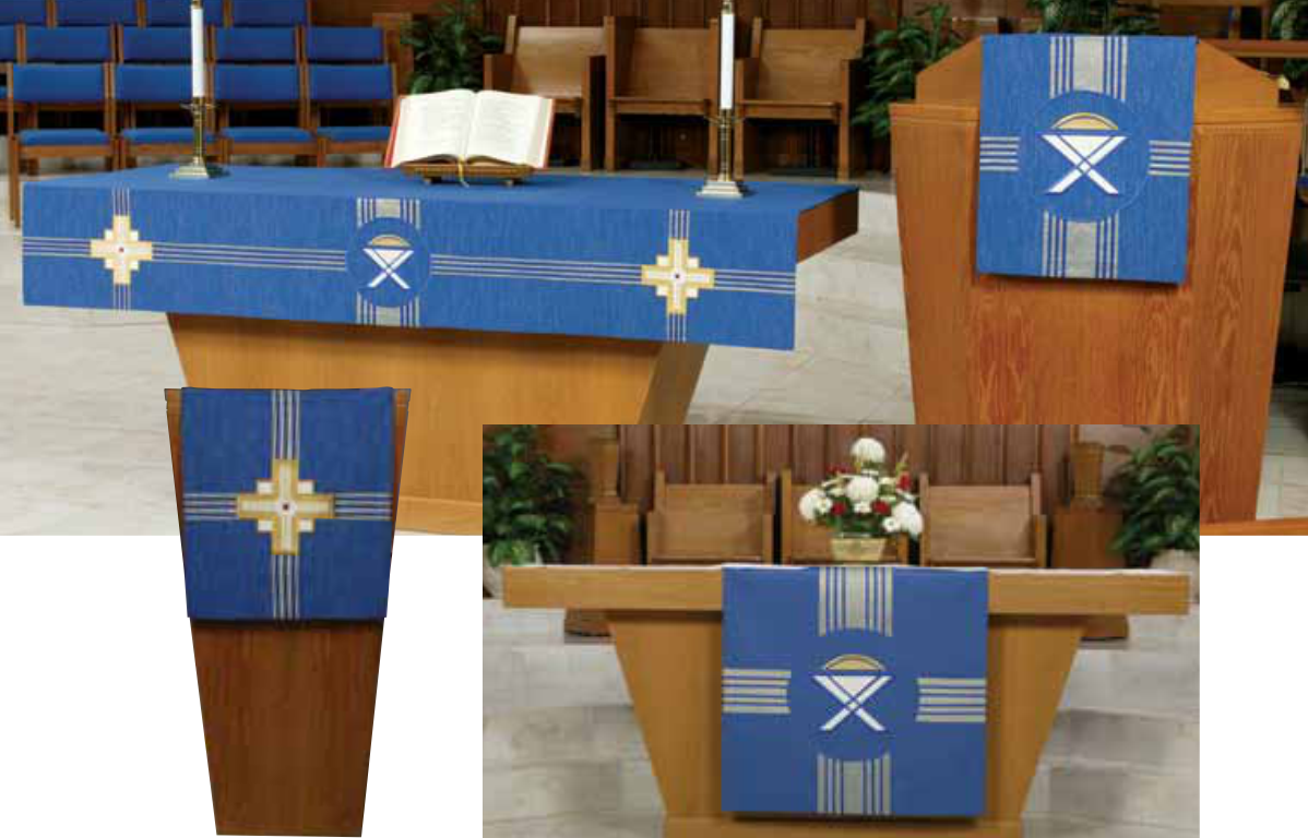 Pulpit with blue decorative cover featuring a cross symbol in a church setting.