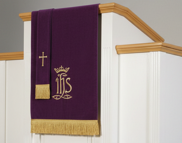 Pulpit  with purple and green cloths featuring symbols in a church setting