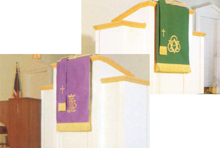 Pulpit with purple and green cloths featuring symbols in a church setting