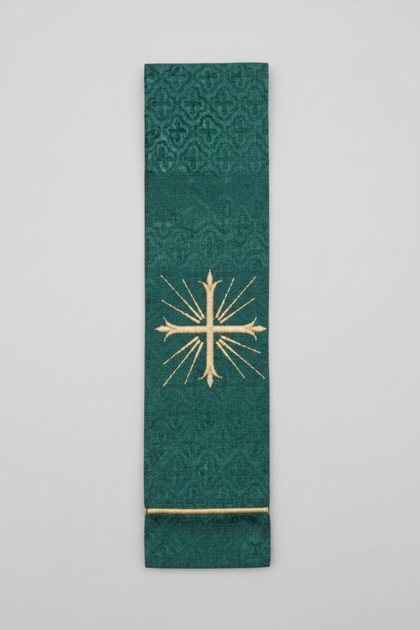 Green fabric strip with gold cross design on a white background