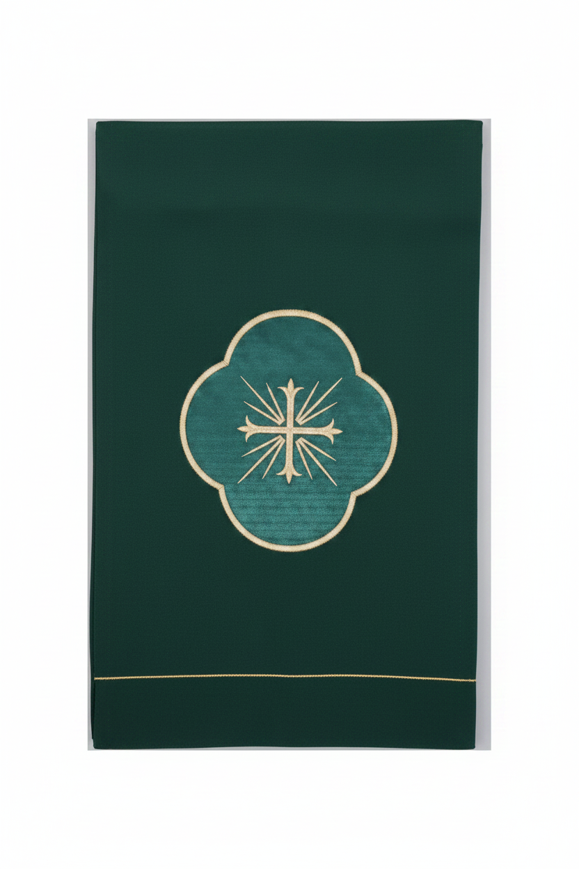 Dark green fabric with a central embroidered design on a white background