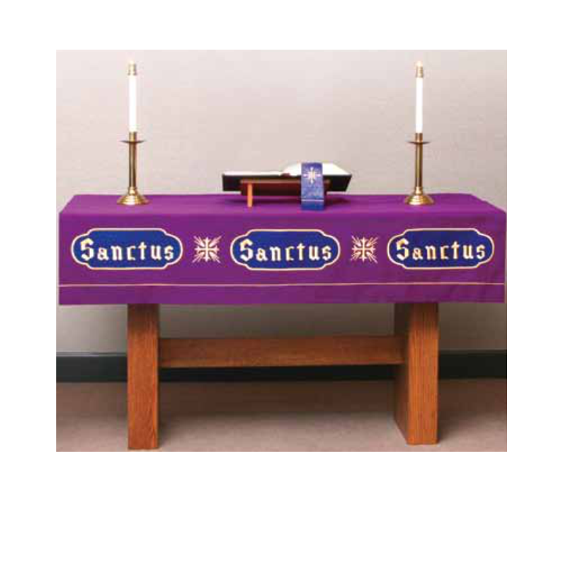 Purple tablecloth with ' Sanctus' text on a wooden table